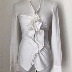 Carolina Herrera white ruffle zip front blouse.